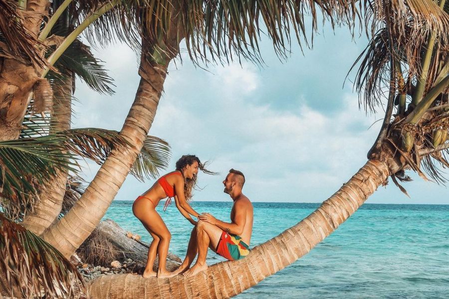 Couple enjoying a secluded beach spot in belize
