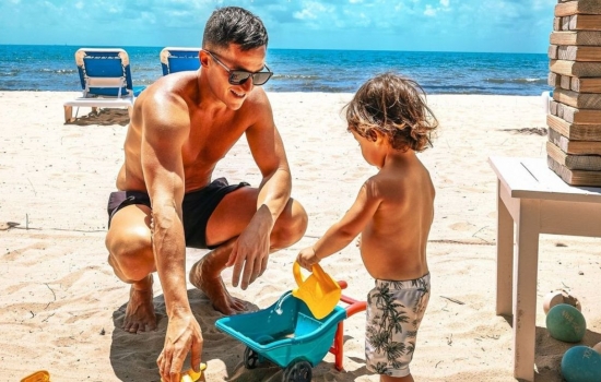 father and child on the beaches of Belize